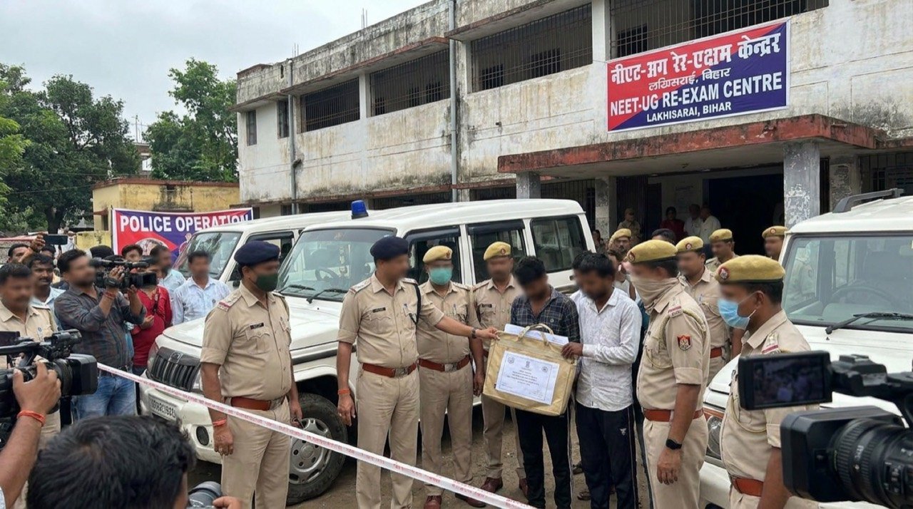 Bihar Police officials outside a NEET-UG re-exam centre in Lakhisarai after busting an alleged cheating and impersonation racket.
