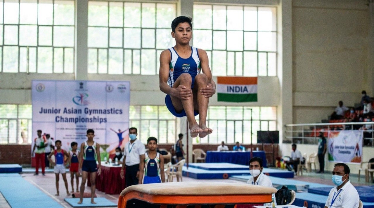 Indian junior gymnast mid-flight in the men's vault at the Junior Asian Gymnastics Championships
