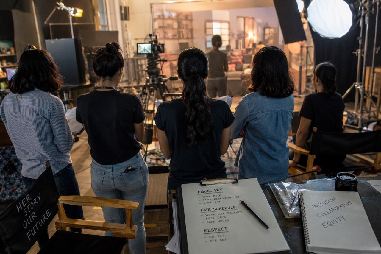 A film set with lights, camera equipment and an empty actor's chair, representing the debate over how women are treated in Hindi cinema
