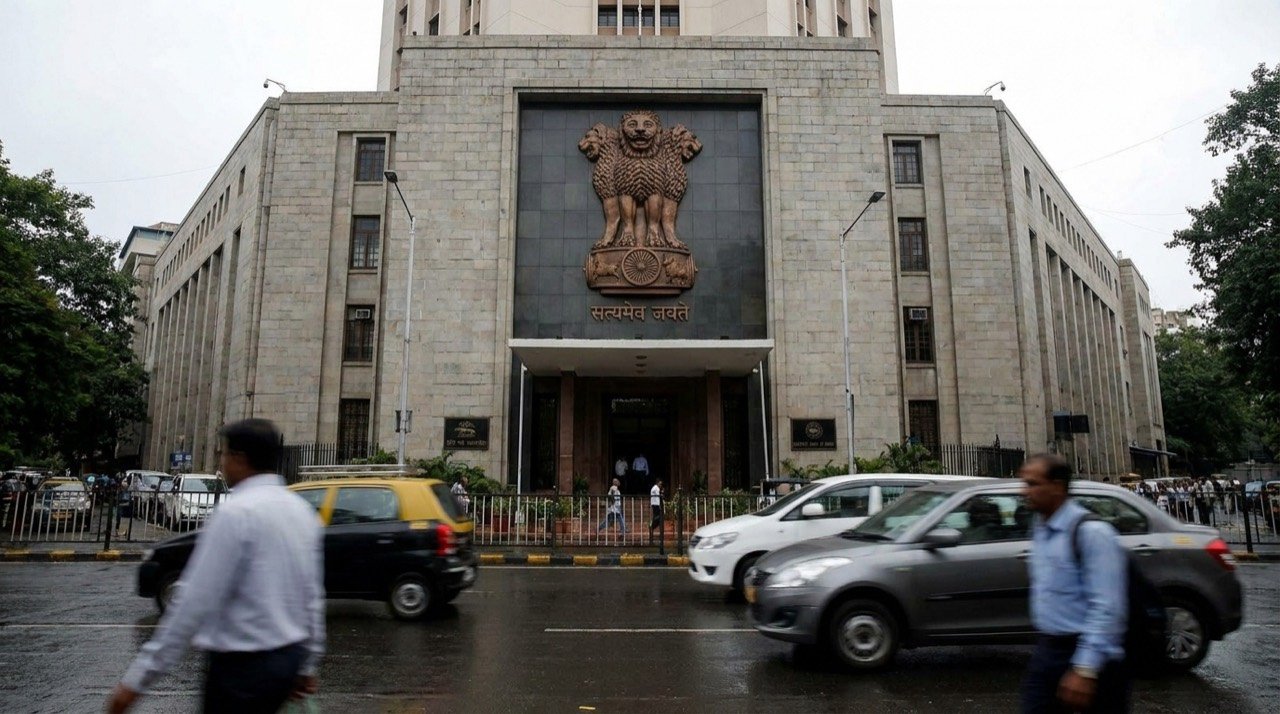 The Reserve Bank of India headquarters building with the central bank's emblem visible.