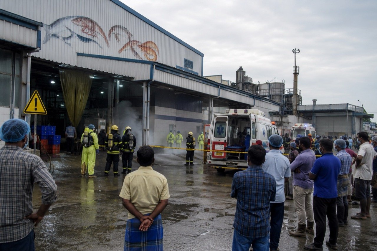 Emergency responders and officials outside a seafood processing factory in Tiruvallur district, Tamil Nadu, after an ammonia gas leak.